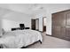 Bedroom boasts ceiling fan, desk, natural light and carpet at 3100 Barbour Trl, Odessa, FL 33556