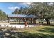 Community pavilion with picnic tables, grills and shaded seating area at 3100 Barbour Trl, Odessa, FL 33556