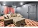 Home theater features a large screen, comfortable seating, and dark walls for an immersive experience at 3100 Barbour Trl, Odessa, FL 33556