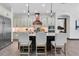 Spacious kitchen with stainless appliances, a center island, and an arched doorway at 3100 Barbour Trl, Odessa, FL 33556
