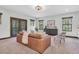 Inviting living room with a leather sofa, stylish chairs, and modern decor at 3100 Barbour Trl, Odessa, FL 33556