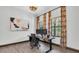 Bright home office with a modern, adjustable standing desk and colorful art at 3100 Barbour Trl, Odessa, FL 33556