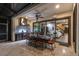 Inviting outdoor kitchen featuring a stainless steel grill, sleek countertops, and comfortable seating area at 3100 Barbour Trl, Odessa, FL 33556