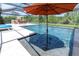 Screened-in pool featuring a pool with water features, and a built-in sun shelf at 3100 Barbour Trl, Odessa, FL 33556