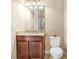 Bathroom featuring modern vanity with granite countertop and commode at 3243 Watermark Dr, Wesley Chapel, FL 33544