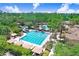 Stunning community pool area complete with water slide, lap pool, and plenty of lounging areas at 3243 Watermark Dr, Wesley Chapel, FL 33544