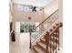 Entryway featuring staircase and open floorplan with lots of natural light, leading to outdoor living space at 3243 Watermark Dr, Wesley Chapel, FL 33544