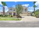 Charming two-story home with a well-maintained lawn and attractive landscaping at 3243 Watermark Dr, Wesley Chapel, FL 33544