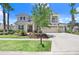 Charming two-story home with a well-maintained lawn and attractive landscaping at 3243 Watermark Dr, Wesley Chapel, FL 33544