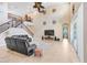Cozy living room with a staircase, contemporary decor, and a view of the upstairs hallway at 3243 Watermark Dr, Wesley Chapel, FL 33544