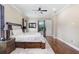 Spacious bedroom featuring stylish furniture, with a well lit background view at 3243 Watermark Dr, Wesley Chapel, FL 33544