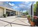 Screened-in outdoor living with pool, spa, and water feature at 3243 Watermark Dr, Wesley Chapel, FL 33544