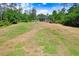 Open grassy field with soccer goal, shade trees and covered picnic pavilion at 3243 Watermark Dr, Wesley Chapel, FL 33544