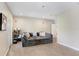 Cozy home theater with comfortable seating, custom decor, and a projector setup at 3243 Watermark Dr, Wesley Chapel, FL 33544