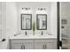 Bright bathroom features dual sinks, modern fixtures, and a spacious walk-in closet at 3269 Reservoir St, North Port, FL 34288