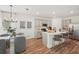 Open kitchen with stainless appliances, granite countertops, and a casual breakfast area at 3269 Reservoir St, North Port, FL 34288