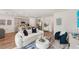 Inviting living room with kitchen view, modern furnishings, and open layout at 3269 Reservoir St, North Port, FL 34288