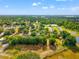 Aerial view of a neighborhood with green spaces and proximity to essential amenities at 3611 W Reynolds St # 1/2, Plant City, FL 33563