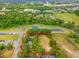 Aerial view of lot with tree coverage near community features and amenities at 3611 W Reynolds St # 1/2, Plant City, FL 33563