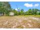Spacious backyard featuring a storage shed and ample room for various activities at 3611 W Reynolds St # 1/2, Plant City, FL 33563