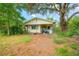 Charming single-story home featuring a covered front porch and mature trees at 3611 W Reynolds St # 1/2, Plant City, FL 33563