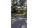 Charming home featuring a chain-link fence and a well-maintained front yard, with mature trees adding curb appeal at 3611 W Reynolds St # 1/2, Plant City, FL 33563