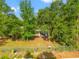 Elevated view of a home with mature trees, showcasing privacy and natural beauty at 3611 W Reynolds St # 1/2, Plant City, FL 33563