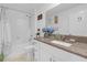 Bathroom featuring granite counters, white subway tile, shower and tub combo at 36568 Garden Wall Way, Zephyrhills, FL 33541