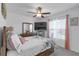 Bright bedroom with ceiling fan, closet and large window at 36568 Garden Wall Way, Zephyrhills, FL 33541