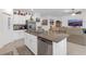 Spacious kitchen featuring stainless steel appliances, granite countertops, and open floor plan at 36568 Garden Wall Way, Zephyrhills, FL 33541