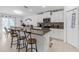 Modern kitchen showcasing granite countertops, stainless steel appliances, and bar seating at 36568 Garden Wall Way, Zephyrhills, FL 33541