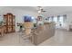 Spacious living room with ample natural light, tile flooring, and comfortable seating at 36568 Garden Wall Way, Zephyrhills, FL 33541