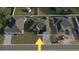 An aerial view showcases this house with its landscaping, driveway, and neighboring properties at 37533 Teri Ct, Dade City, FL 33525