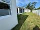 Well-maintained backyard with a screened-in porch area and fencing, offering a private outdoor space at 37533 Teri Ct, Dade City, FL 33525
