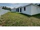 Spacious backyard featuring a screened lanai, perfect for outdoor living and entertaining, with a white privacy fence at 37533 Teri Ct, Dade City, FL 33525