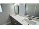 Bathroom vanity with double sinks and granite countertops at 37533 Teri Ct, Dade City, FL 33525