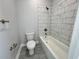 Modern bathroom with tiled tub and tile floors at 37533 Teri Ct, Dade City, FL 33525
