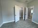 Bedroom features an open closet and tile flooring at 37533 Teri Ct, Dade City, FL 33525