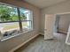 Bright room with a large window overlooking a landscaped yard at 37533 Teri Ct, Dade City, FL 33525