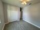 Neutral bedroom featuring a closet and overhead light offers comfortable, clutter-free living at 37533 Teri Ct, Dade City, FL 33525