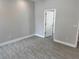 Well-lit bedroom with soft gray walls and modern floors offering a clean, comfortable space at 37533 Teri Ct, Dade City, FL 33525