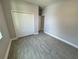 Well-lit bedroom with closet and light gray walls offering a simple, comfortable space at 37533 Teri Ct, Dade City, FL 33525
