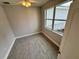 Well-lit bedroom with a ceiling fan and large window providing natural light at 37533 Teri Ct, Dade City, FL 33525