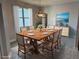 Elegant dining room featuring a modern chandelier and view to backyard at 37533 Teri Ct, Dade City, FL 33525