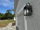 Close up of the home's exterior lighting, that accents the color and textures of the house at 37533 Teri Ct, Dade City, FL 33525