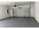 Spacious two-car garage with automatic door and gray painted floors at 37533 Teri Ct, Dade City, FL 33525