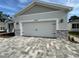 Close-up of the home's garage door, featuring decorative hardware and stone accents at 37533 Teri Ct, Dade City, FL 33525