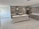 Well-appointed kitchen featuring stainless steel appliances, a large island, and stylish cabinetry at 37533 Teri Ct, Dade City, FL 33525