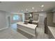 Modern kitchen with a large island, stainless steel appliances, and stylish finishes at 37533 Teri Ct, Dade City, FL 33525