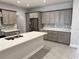 Modern kitchen featuring quartz countertops, stainless steel appliances, and ample cabinetry at 37533 Teri Ct, Dade City, FL 33525